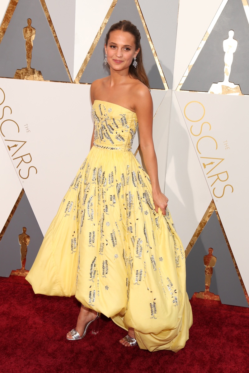 Alicia Vikander on stage at the 2016 Oscars wearing Louis Vuitton
