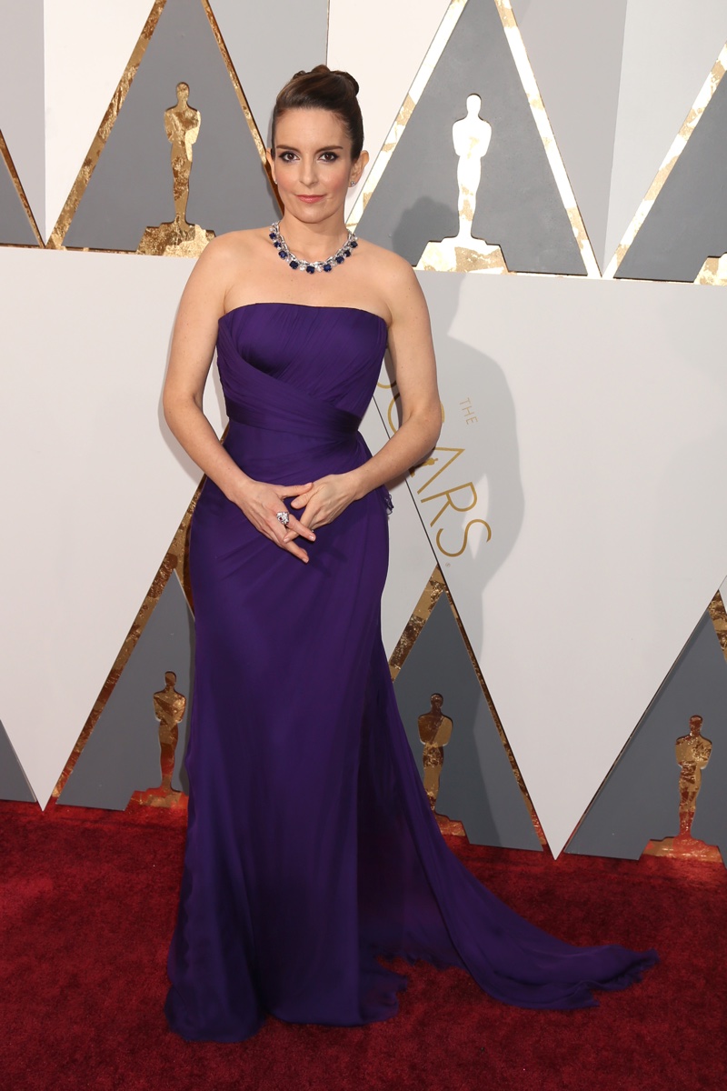 Tina Fey attends the 2016 Oscars wearing a strapless Versace gown in purple with Bulgari jewelry. Photo: Helga Esteb / Shutterstock.com