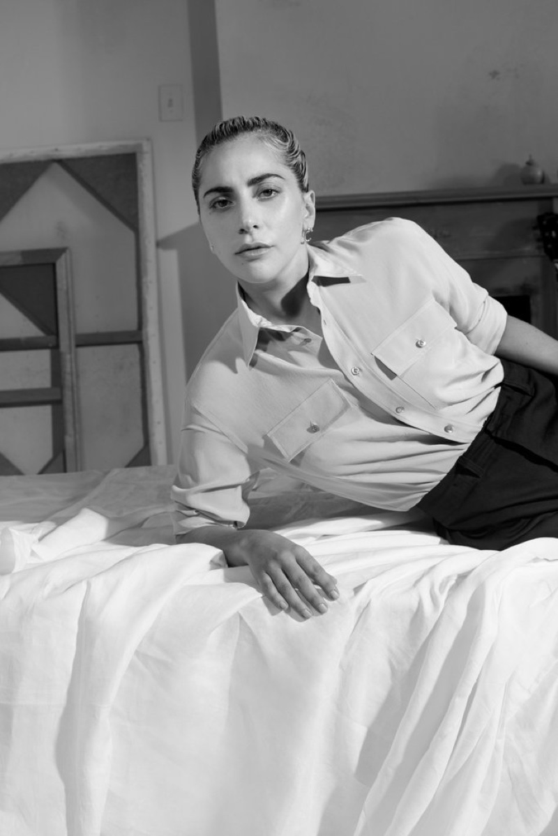 Photographed in black and white, Lady Gaga wears Ralph Lauren Collection shirt and black pants