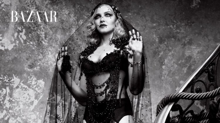 Photographed in black and white, Madonna poses in Gucci cape with La Perla bodice