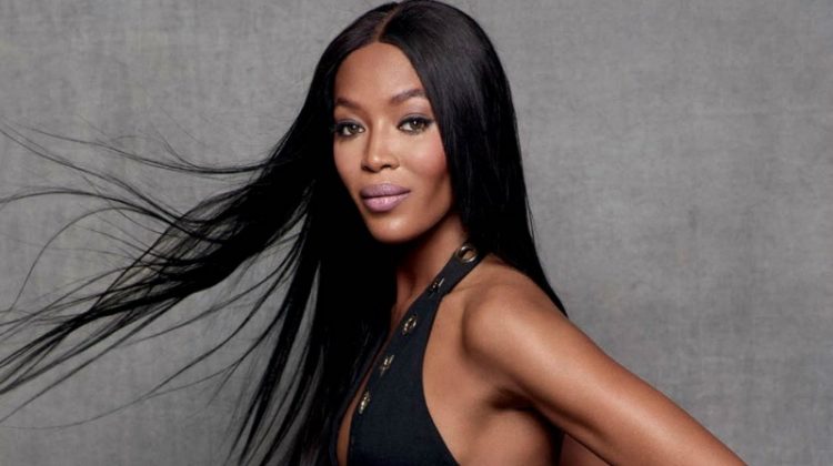 Naomi Campbell poses in little black dress with grommet details