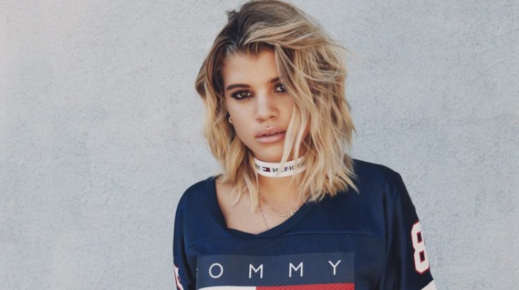 Sofia Richie models Tommy Jeans Cropped Football Tee ($79.50) and Destroyed Denim Short ($119.50)