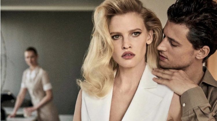 Lara Stone smolders in Michael Kors Collection sleeveless jacket, pants and clutch