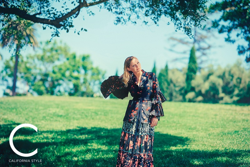 Actress Kirsten Dunst poses in Gucci jacket and skirt