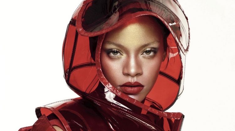 Wearing red lipstick, Rihanna poses in Dolce & Gabbana helmet and PVC coat