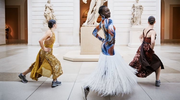 Dancing, Lupita Nyong’o poses in Celine dress, Atelier Swarovski by Christopher Kane bracelets and Giuseppe Zanotti sneakers