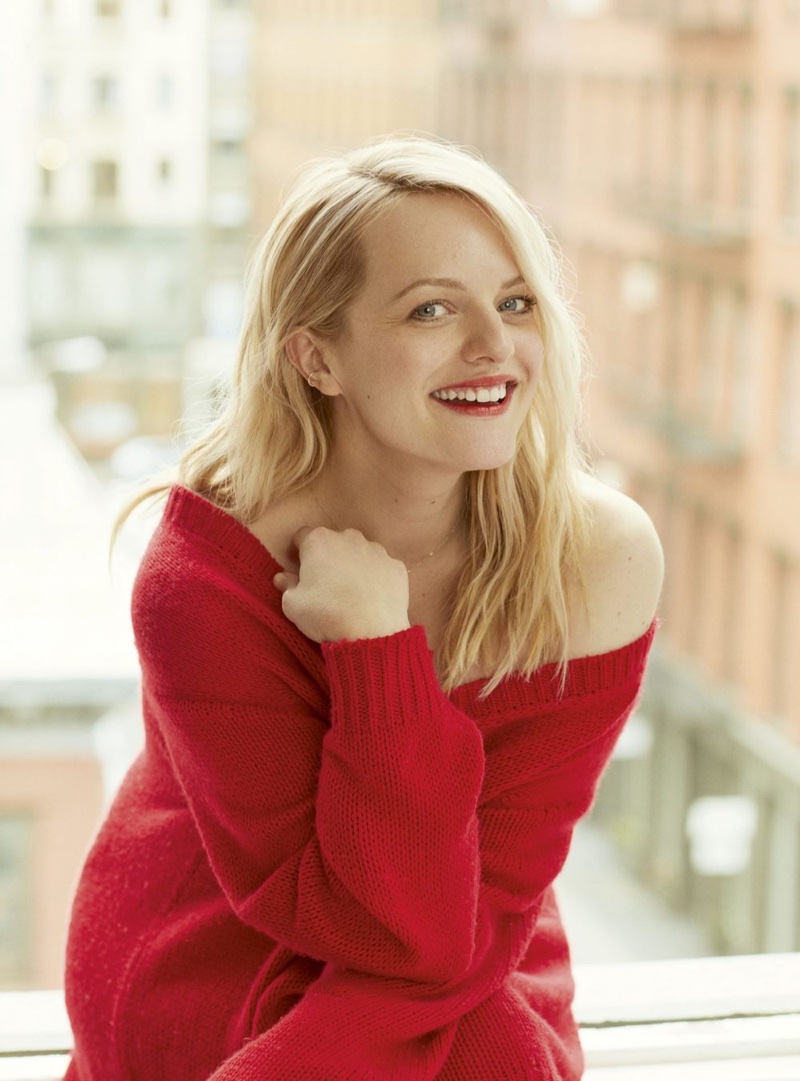 Actress Elisabeth Moss poses in red Dior sweater