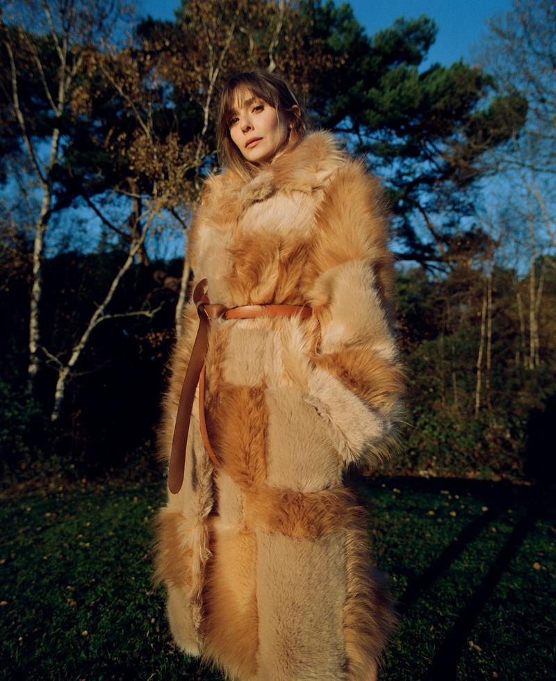 Posing outdoors, Elizabeth Olsen wears Stella McCartney coat. Photo: Amar Daved