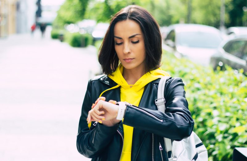 Woman in Hoodie and Leather Biker Jacket