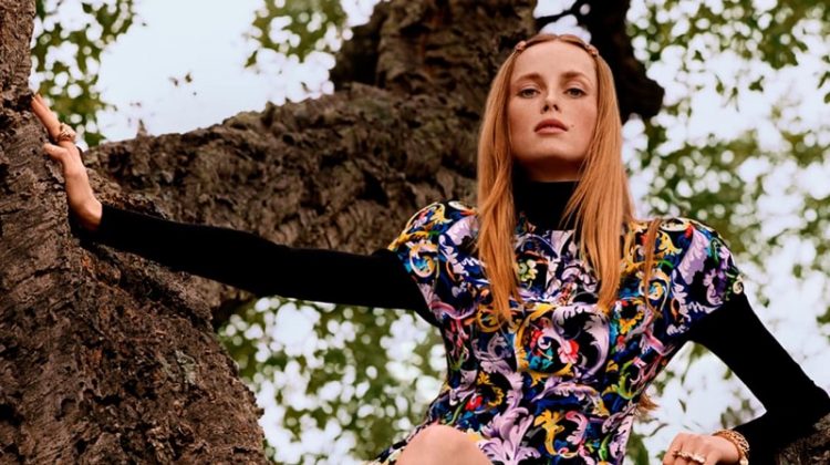 Rianne van Rompaey poses in a tree for Versace pre-fall 2021 campaign.