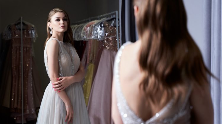 Woman Trying Elegant Dress Mirror Glitter Detail