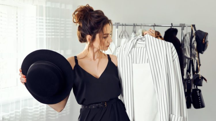 Attractive Woman Selecting Clothes Hat