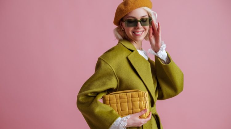 Model Smiling Green Coat Yellow Bag Beret