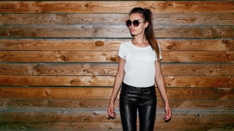 woman white t shirt leather pants