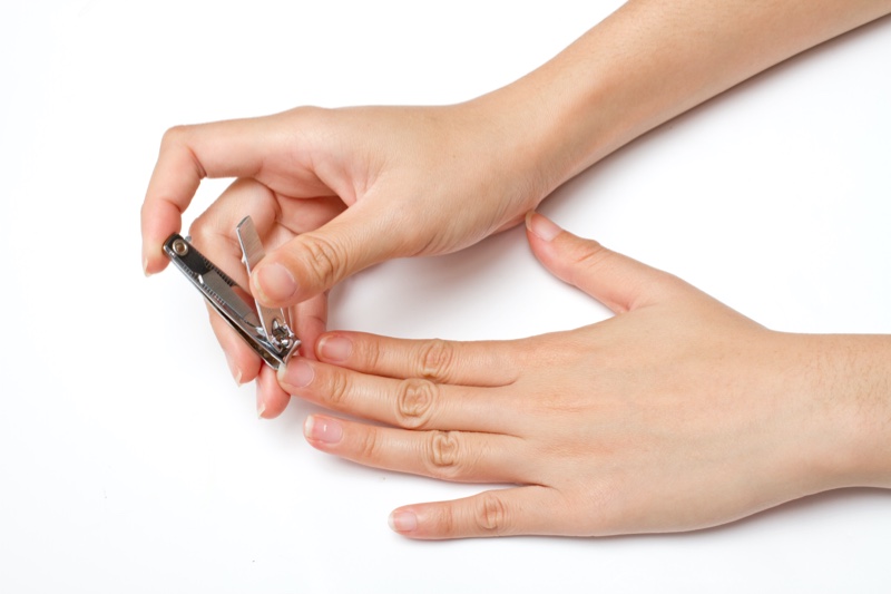 Woman Trimming Nails