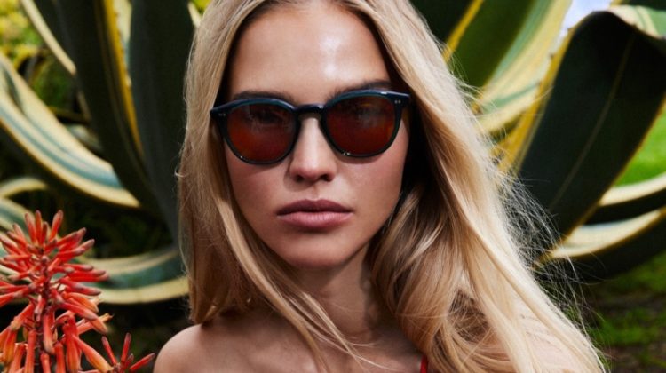 https://www.fashiongonerogue.com/wp-content/uploads/2023/07/Oliver-Peoples-Summer-2023-Campaign-750x420.jpg