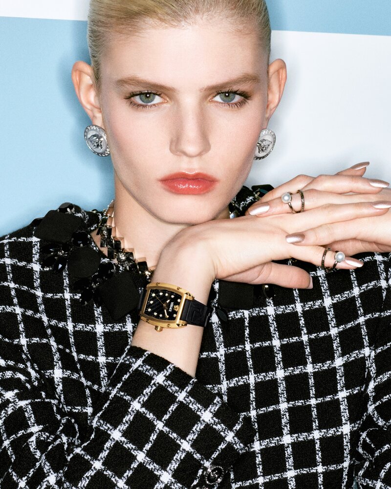 Camille Chifflot exudes elegance in a tweed outfit, complemented by a statement Versace watch for their spring 2024 advertisement.