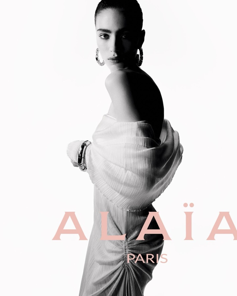 Alaïa highlights a sophisticated draped dress for its summer-fall 2024 campaign.