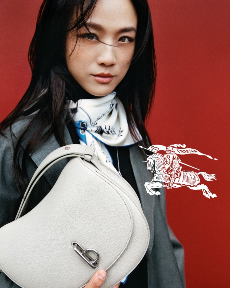Tang Wei layers up with a coat and scarf while showing off Burberry's Rocking Horse bag.