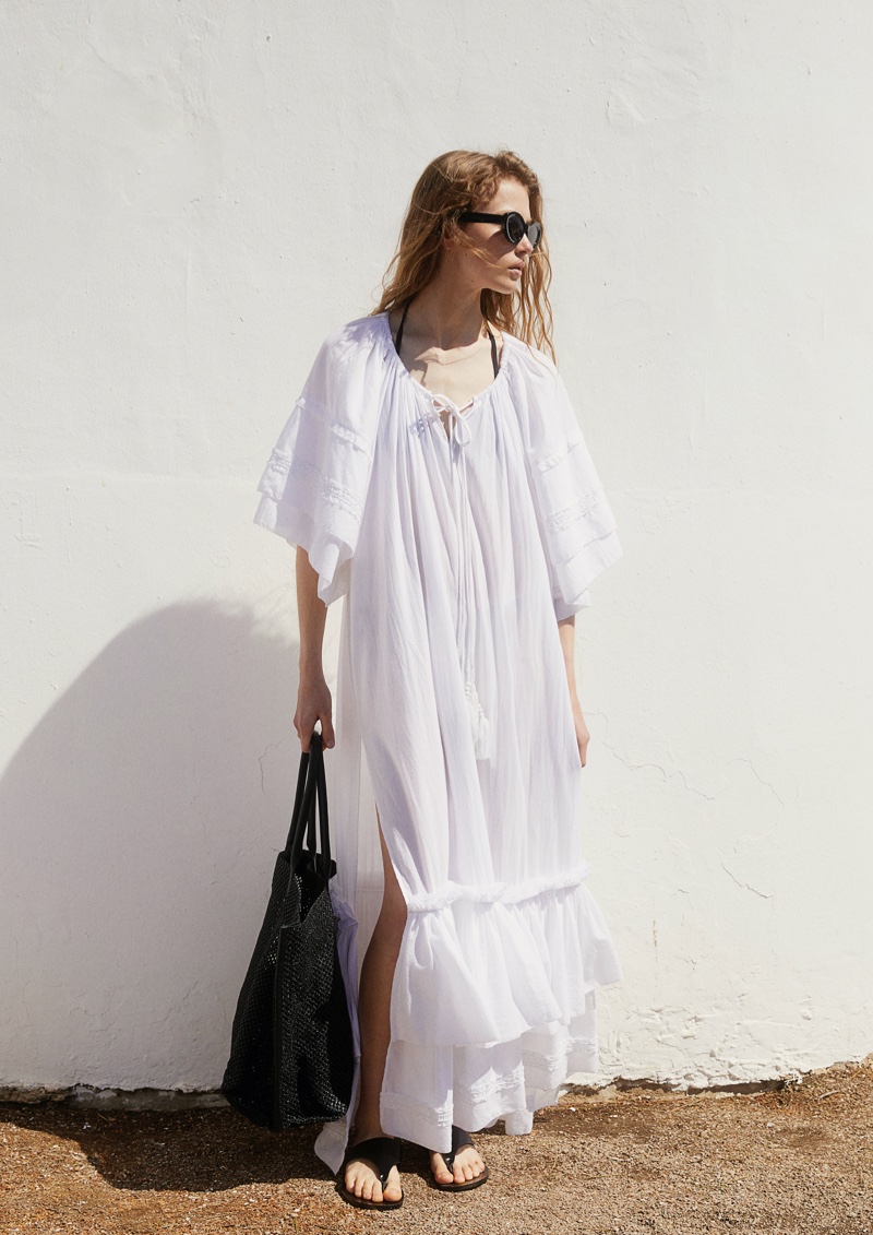 Embrace the summer breeze in H&M Studio's white maxi dress.