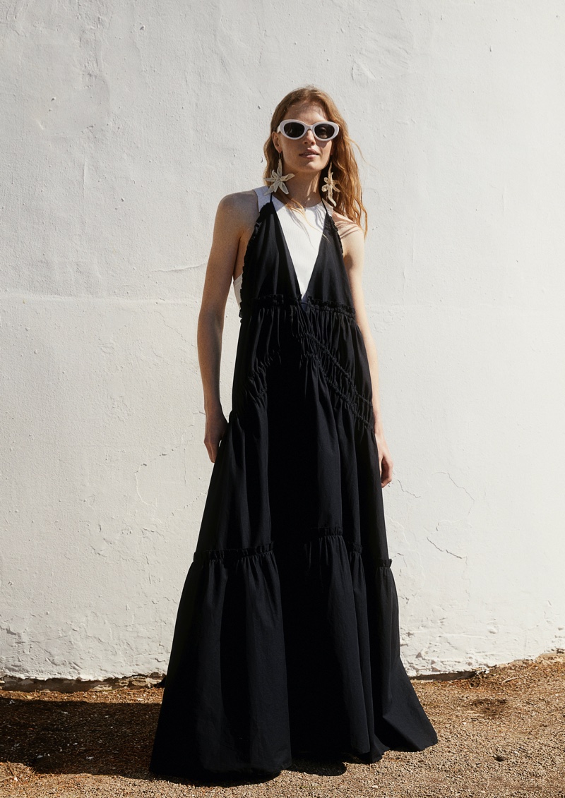 H&M Studio's summer 2024 mini capsule introduces a sleek black dress.