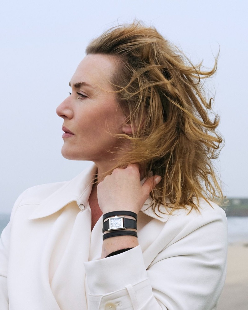 Captured in contemplation, Kate Winslet showcases the sophisticated charm of Longines' Mini DolceVita watch.
