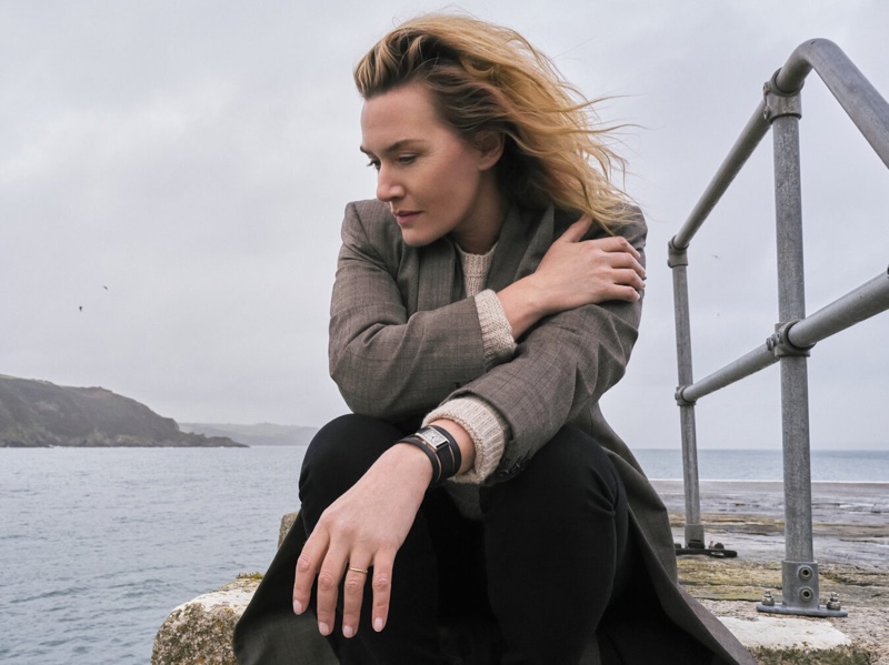 Posing seaside, Kate Winslet shows off Longines' new Mini DolceVita watch featuring double tour straps.