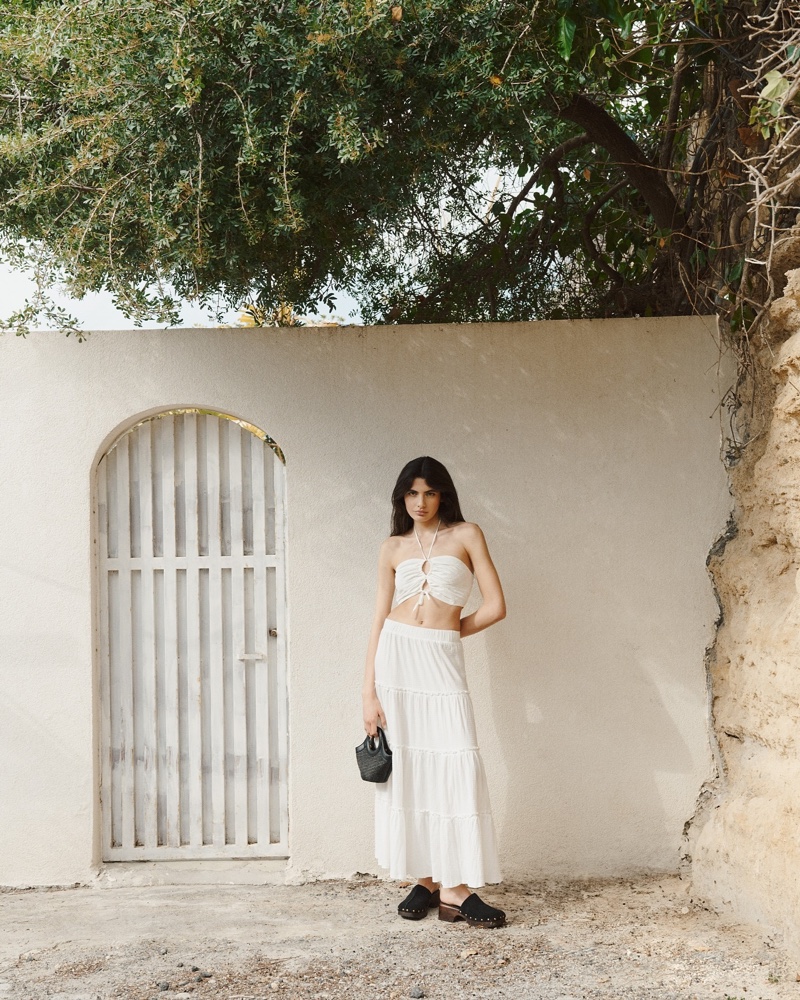 Elegance meets simplicity in this Reserved summer 2024 ensemble featuring a white skirt and cropped top.