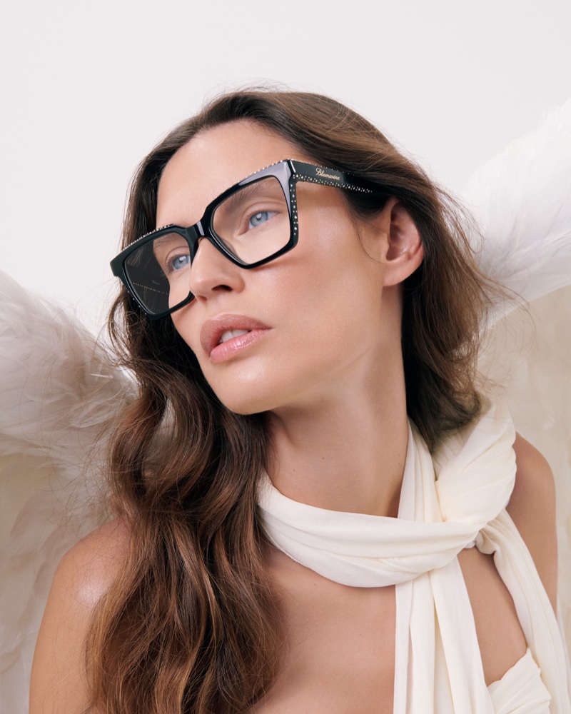 Posing with angel wings, Bianca Balti fronts Blumarine eyewear's summer 2024 ad.