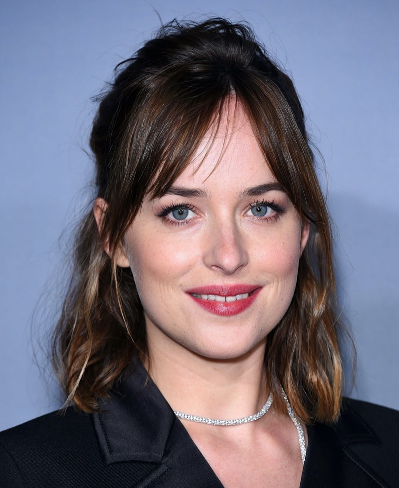 Dakota Johnson half-up half-down hairstyle curtain bangs