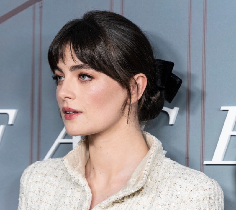 Millie Brady low bun curtain bangs