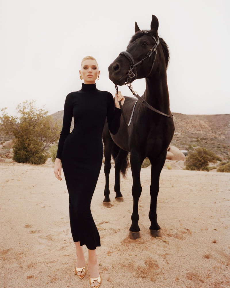 Elsa Hosk models Nana Jacqueline's Dina dress while posing with a black horse.
