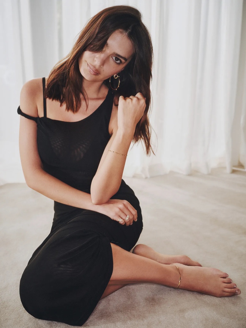 Wearing a black coverup, Emily Ratajkowski charms in Good American's summer edit.