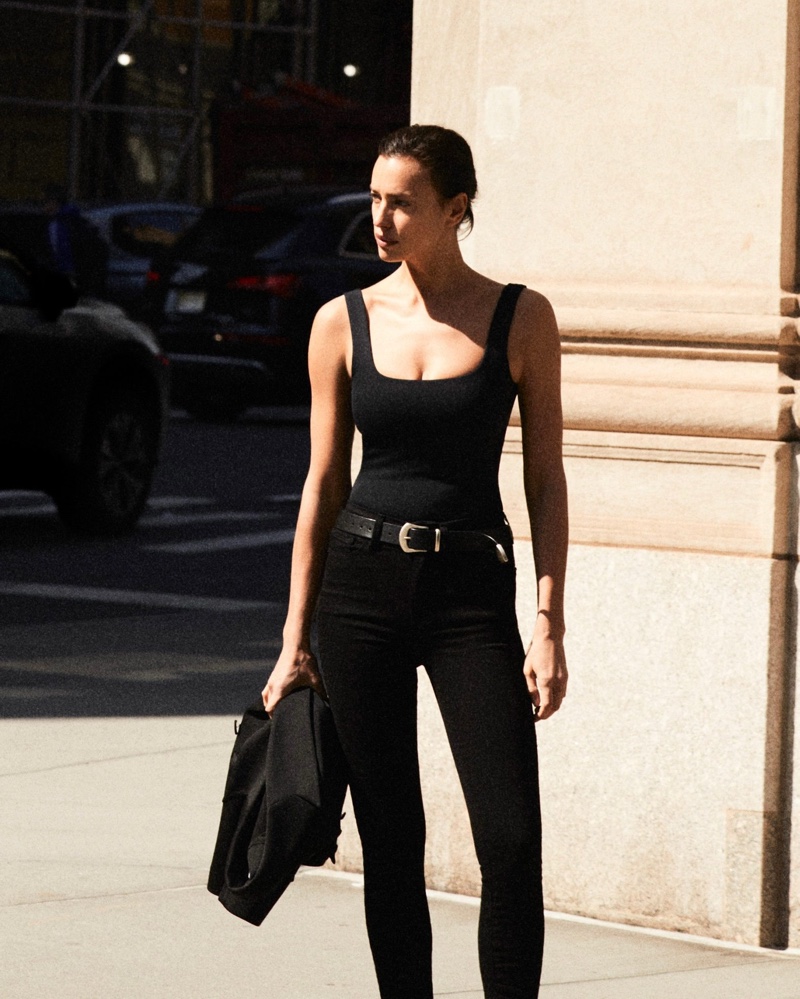 Dressed in all-black, Irina Shayk fronts Good American 2024 denim campaign in a tank top and jeans.