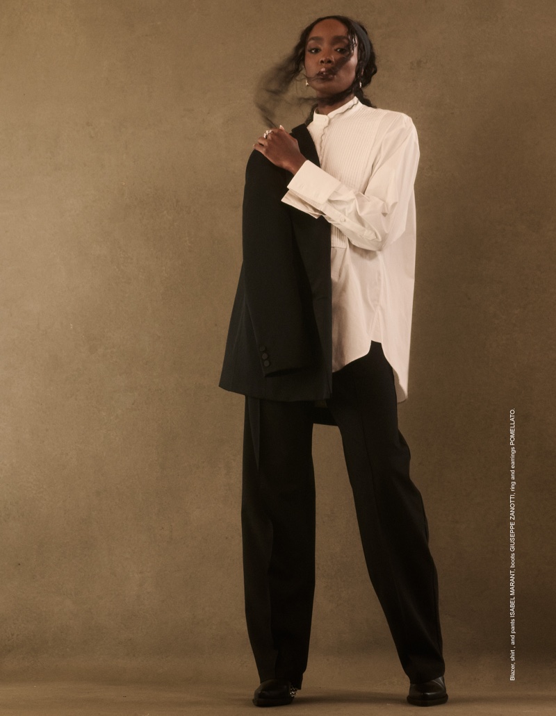 Posing in a monochrome look, Kiki Layne suits up in relaxed tailoring.