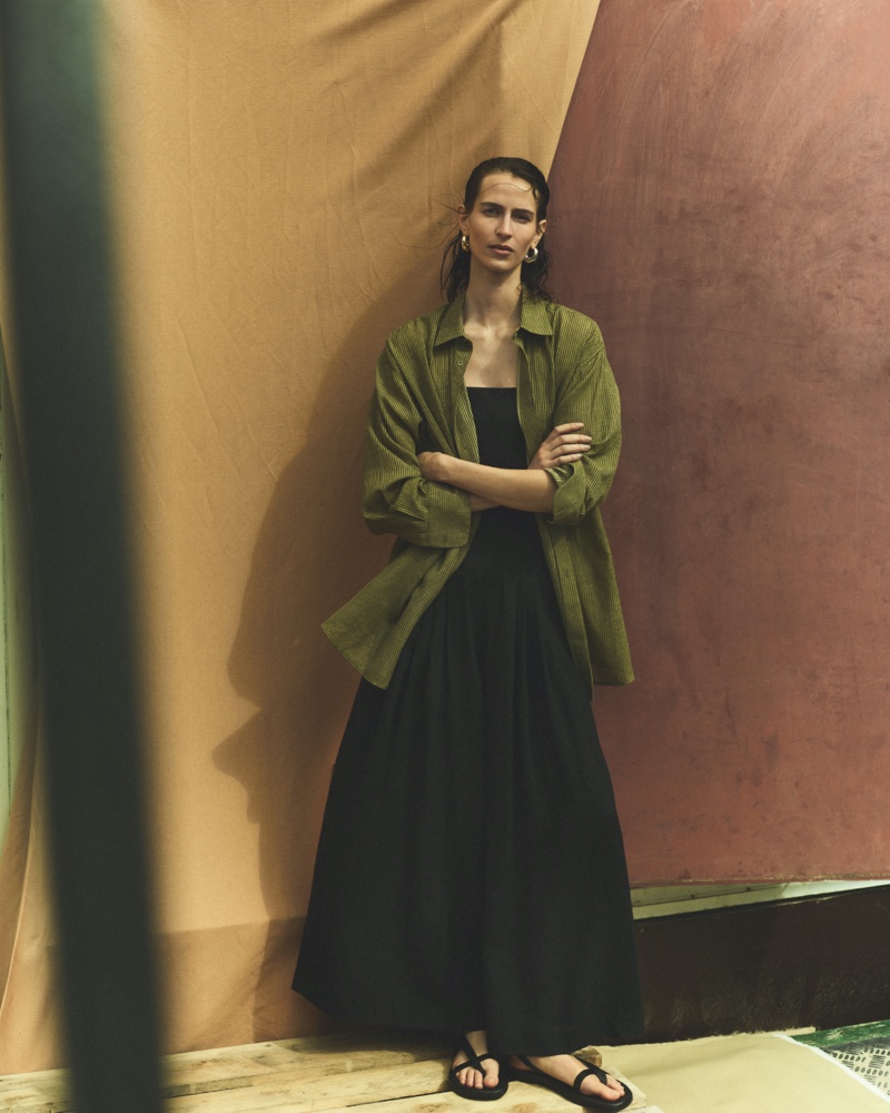 Jeanne Cadieu models olive over shirt with black dress from Massimo Dutti.