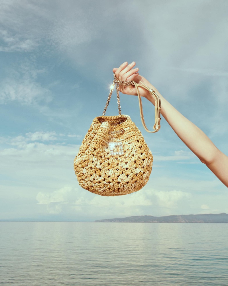 Roger Vivier spotlights the Très Vivier Bucket Bag in crochet for high summer.