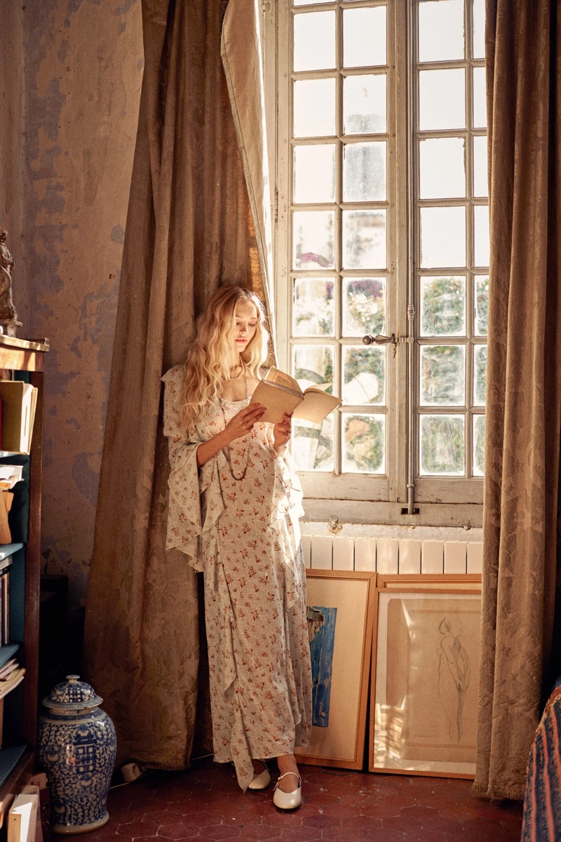 With a book in hand, Théa Ros wears a flutter sleeve dress from the Spell Fleur collection.