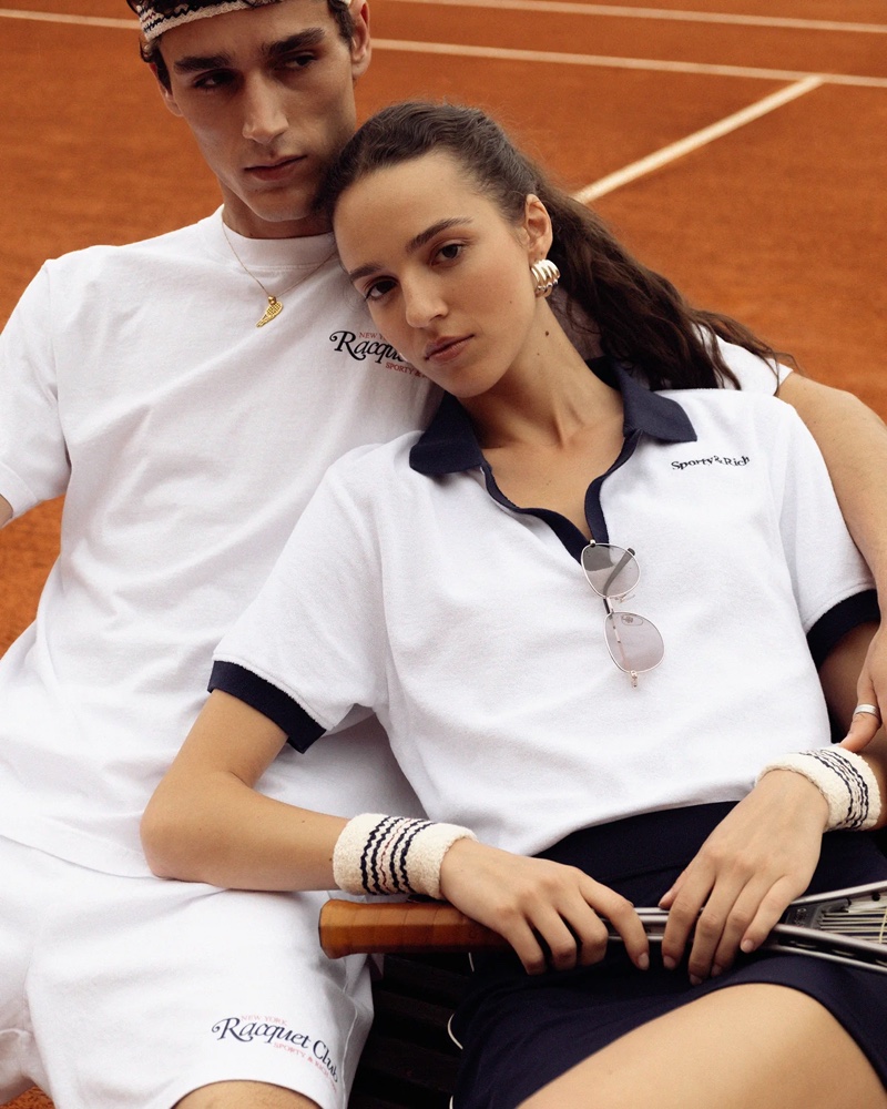 Models Carlos Gómez Galobart and Emm Arruda wears his and hers tennis style from Sporty & Rich's summer drop.