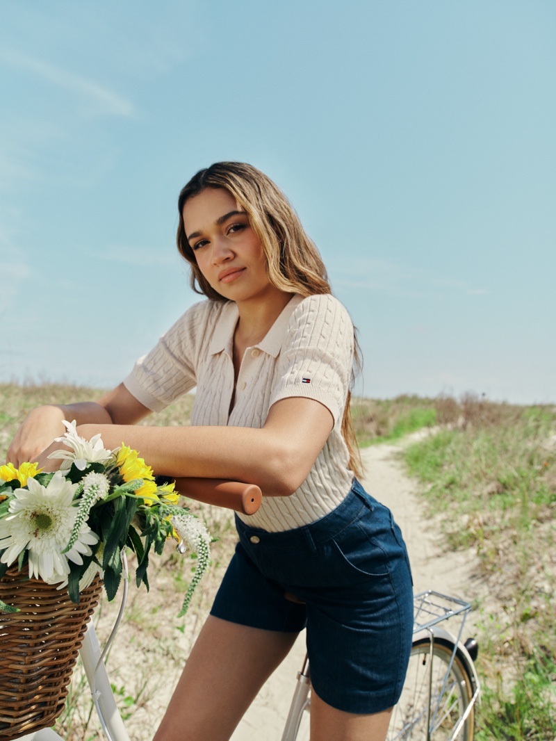 Madison Bailey is preppy chic in a knit top and shorts for the Tommy Hilfiger summer 2024 ad.