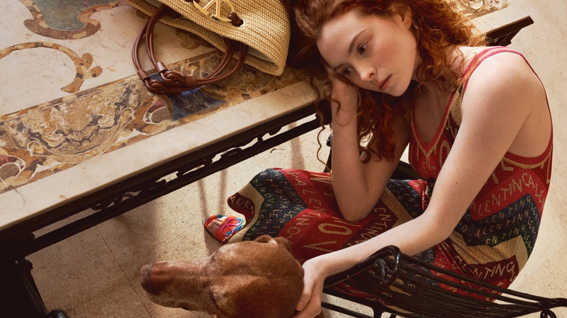 Niamh Maye lounges in a lurex dress for the Valentino Escape 2024 collection.