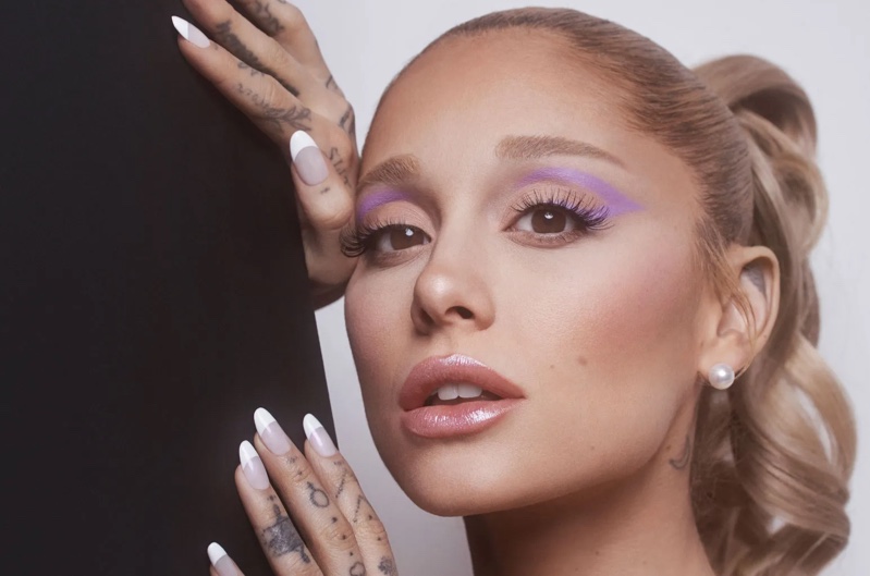 Singer Ariana Grande shows off a purple eyeliner makeup look for r.e.m. Beauty's Borderline collection.