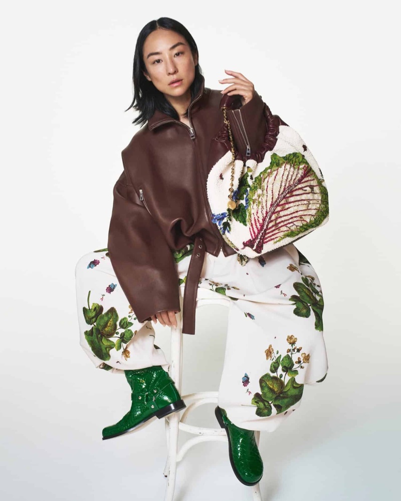 Embracing print, Greta Lee walks a leather jacket and billowing pants for Loewe's fall 2024 collection.