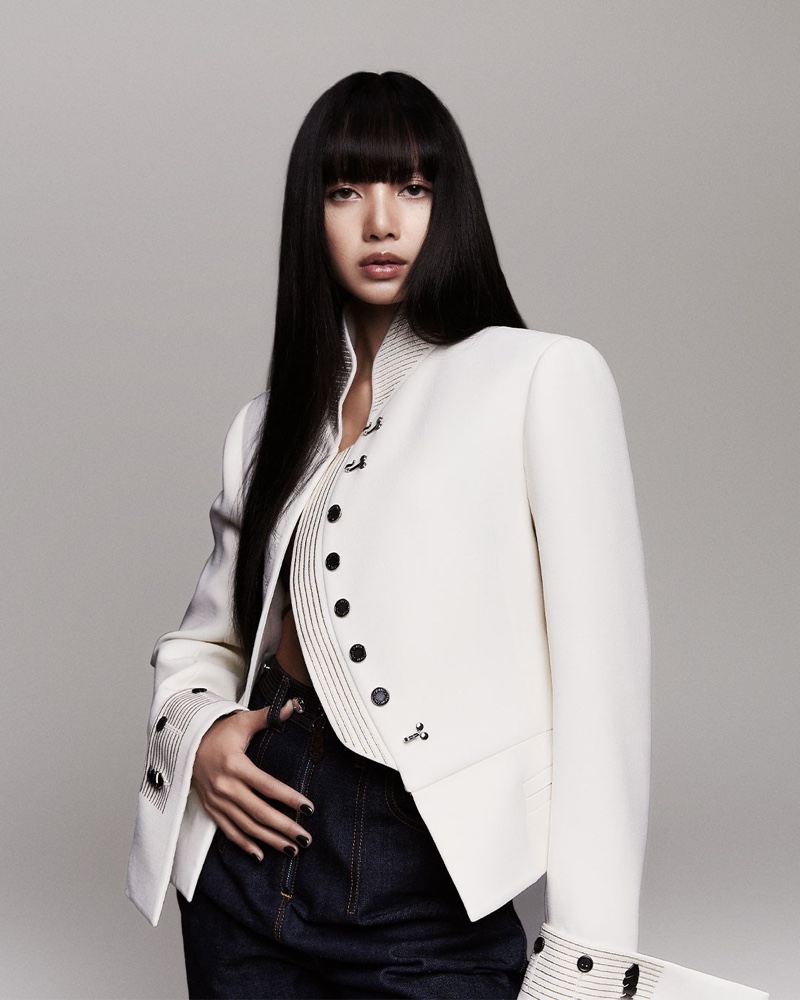 Lisa shows off a tailored white jacket from Louis Vuitton.