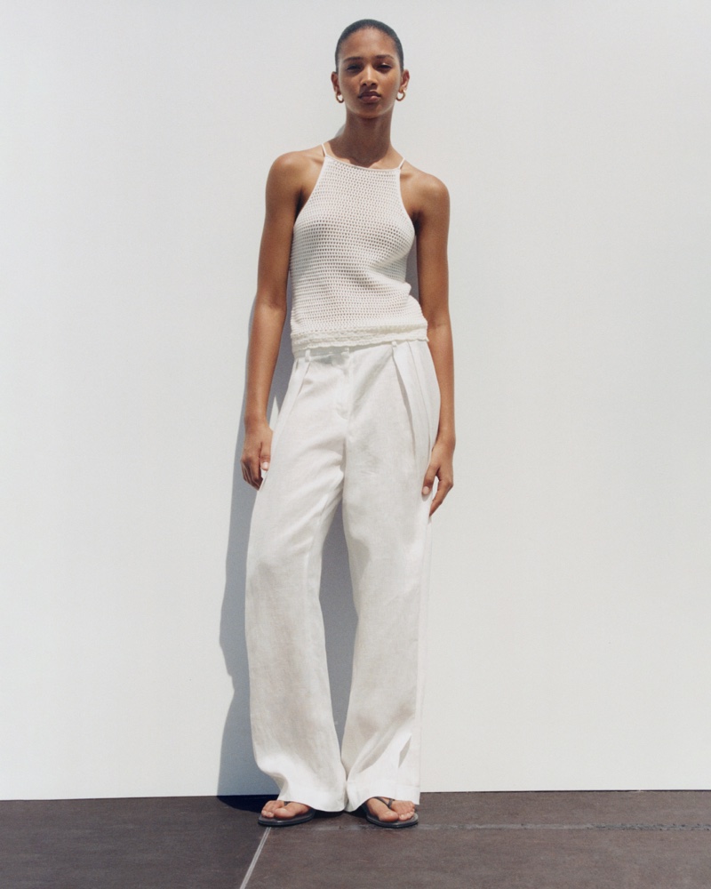 Elodie Guipaud models knit tank top and relaxed pants from Mango's summer arrivals.