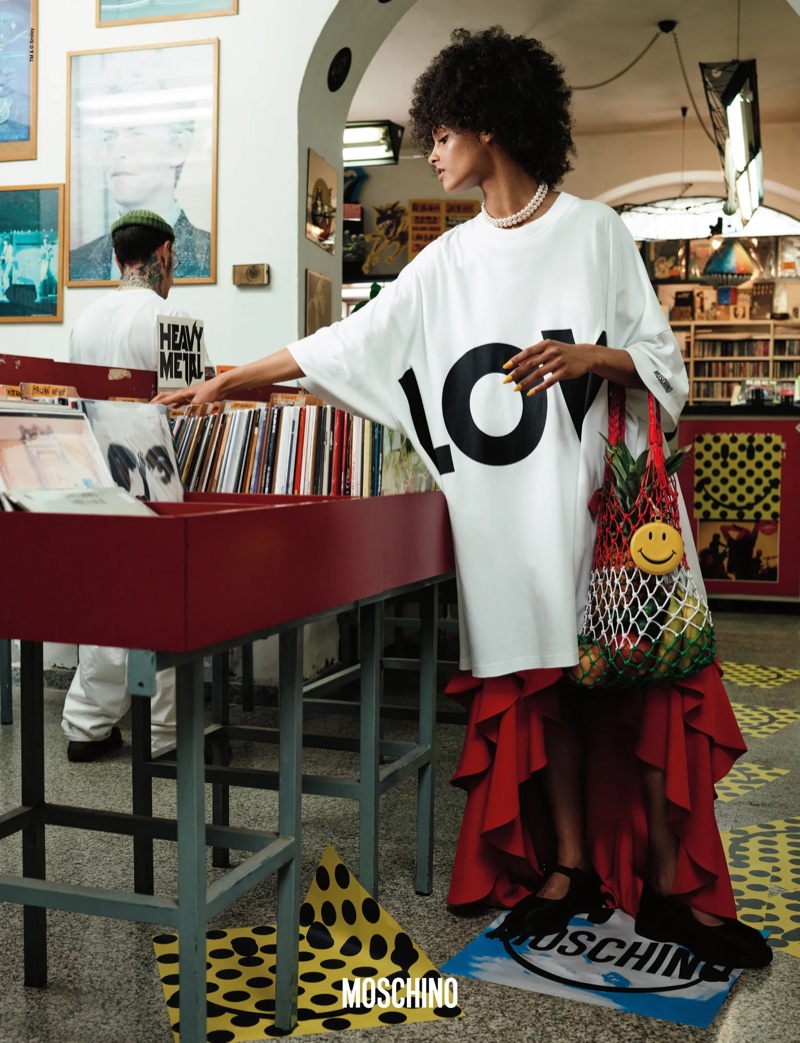 Farah Nieuwburg wears an oversized shirt and ruffled skirt for Moschino's fall 2024 ad.