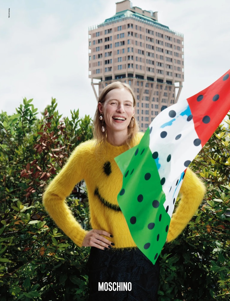 Julia Nobis wears a happy face sweater in Moschino's fall-winter 2024 campaign.