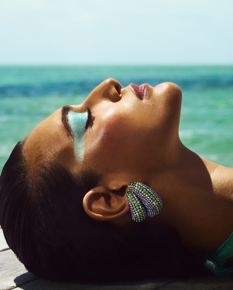 Nour Rizk soaks up the sun in Swarovski's summer-ready earrings.