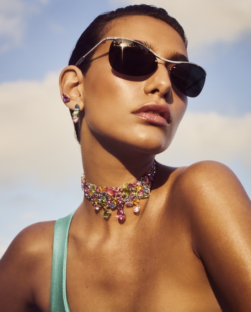 Posing with sunglasses, Nour Rizk models Swarovski's multicolored crystals.