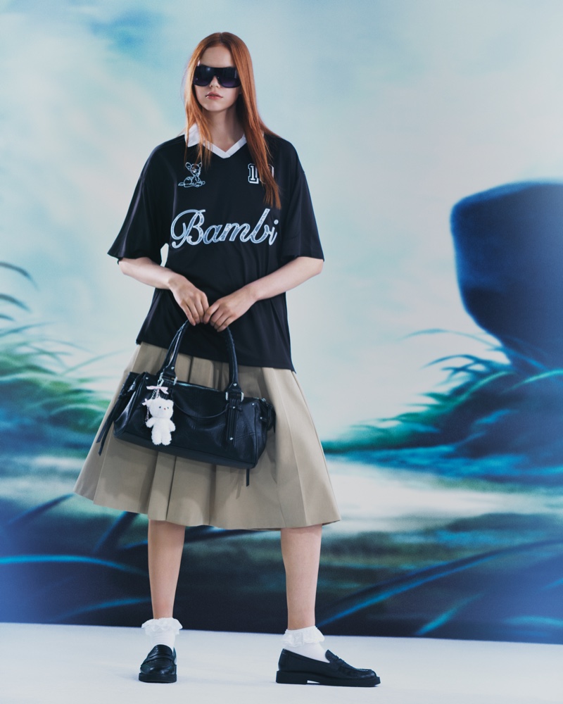 Juxtaposing cute and dark style, Bershka x Bambi features a graphic shirt with a pleated skirt look.